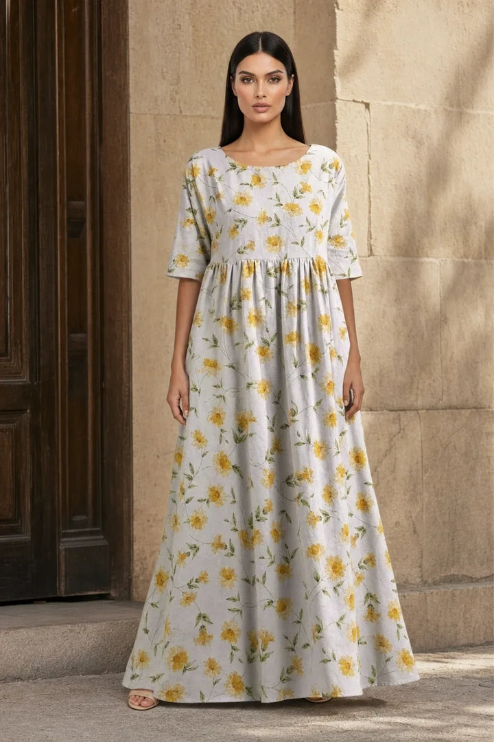 Light yellow floral midi dress on model in contrapposto stance