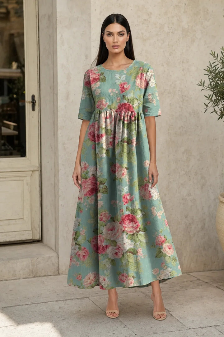 Mint green floral midi dress on model in contrapposto stance