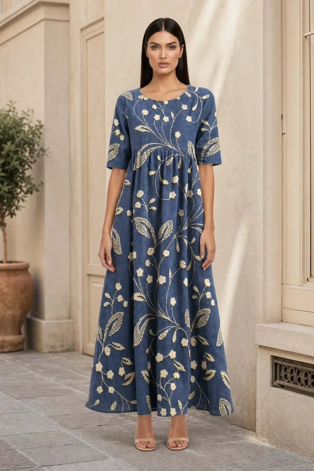 Navy blue floral midi dress on model in contrapposto stance