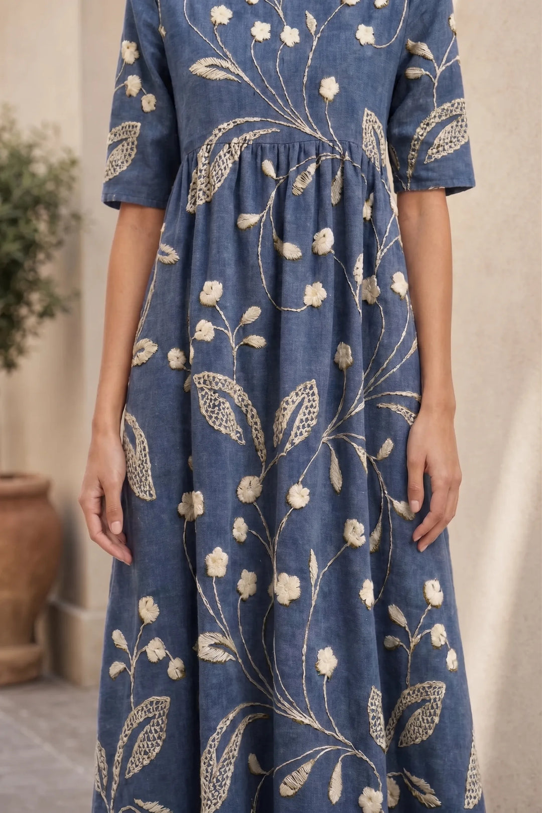 Close-up detail of navy blue floral midi dress fabric and print