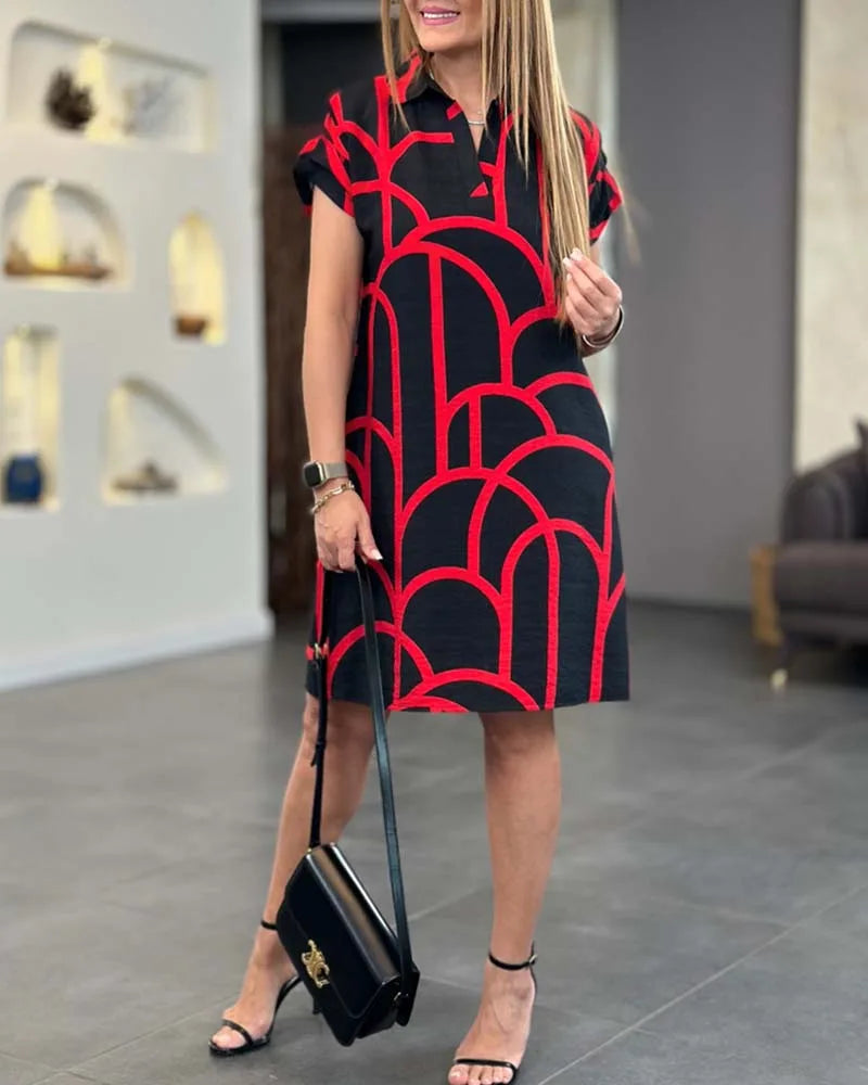 Black geometric print shift dress on model, alternate view
