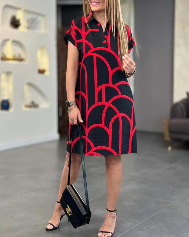 Black geometric print shift dress on model, alternate view