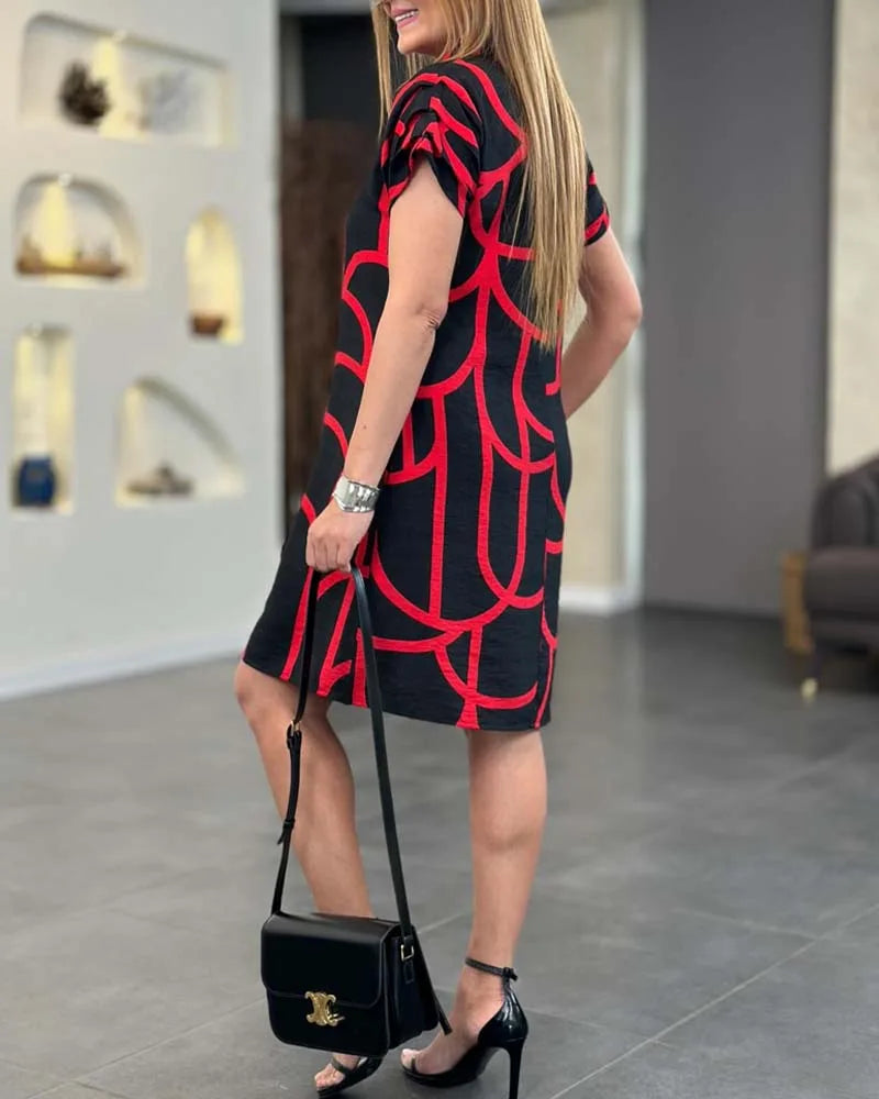 Black geometric print shift dress on model, alternate view