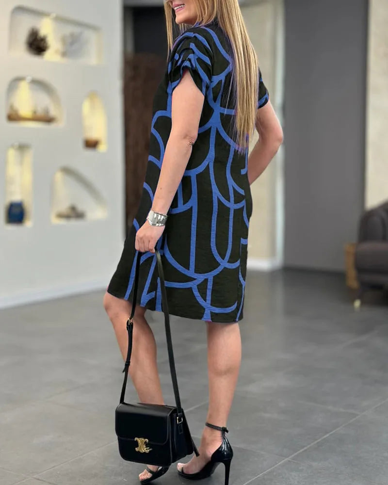 Black geometric print shift dress on model, alternate view