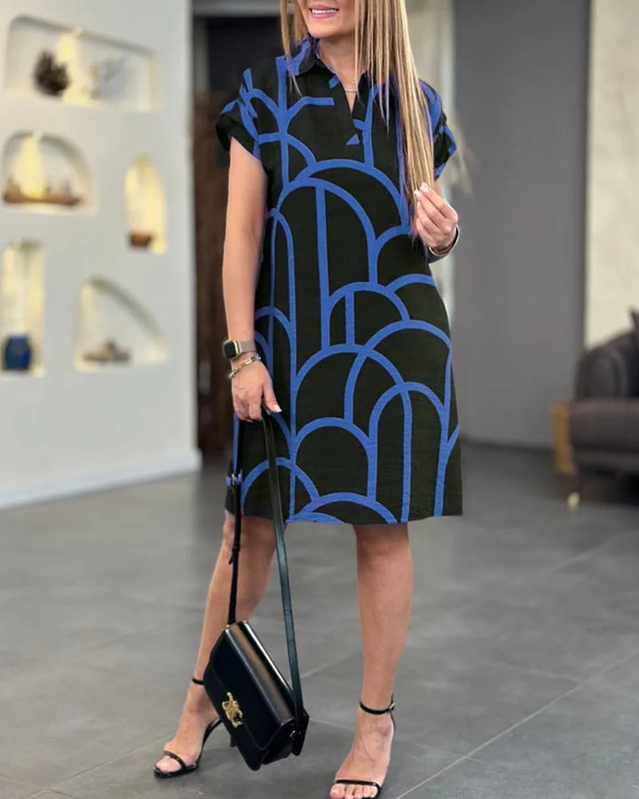 Blue geometric print shift dress on model in side profile