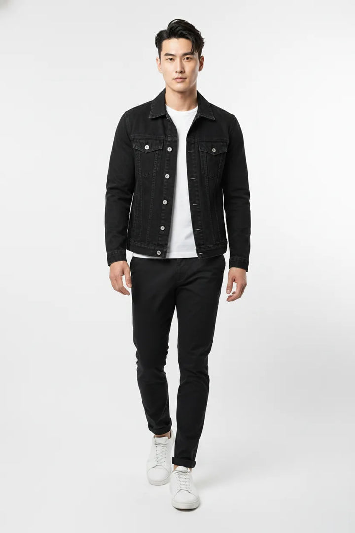 Black denim trucker jacket on model in natural movement pose