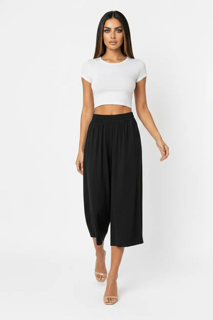 Black cropped wide-leg culottes on a model in natural movement