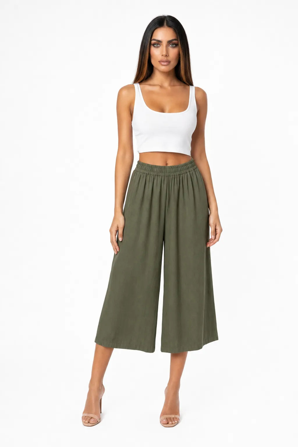 Green cropped wide-leg culottes on a model in a contrapposto stance