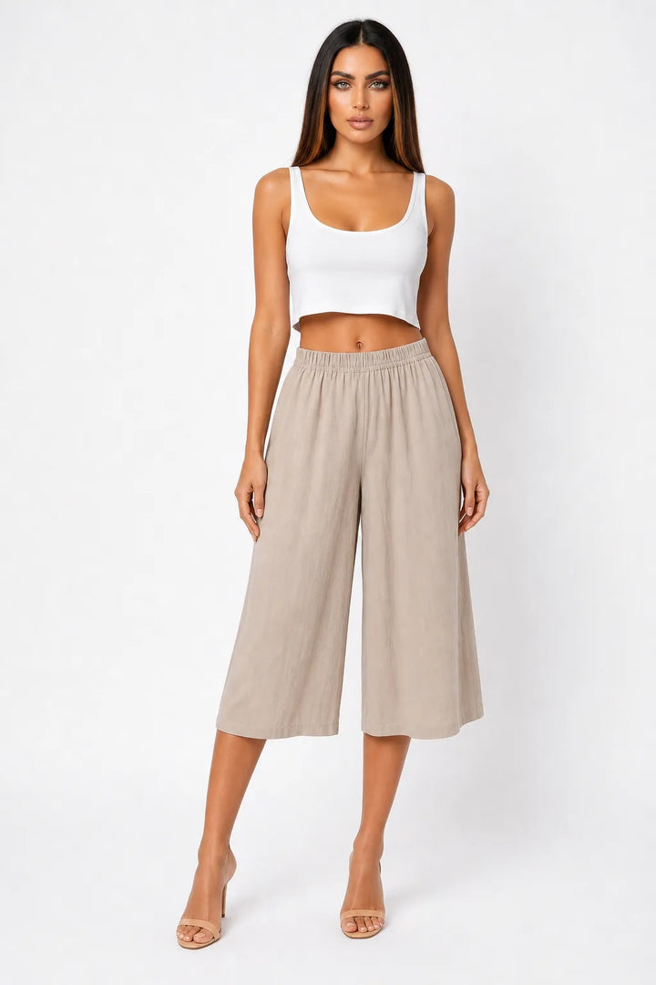 Khaki cropped wide-leg culottes on a model in a contrapposto stance