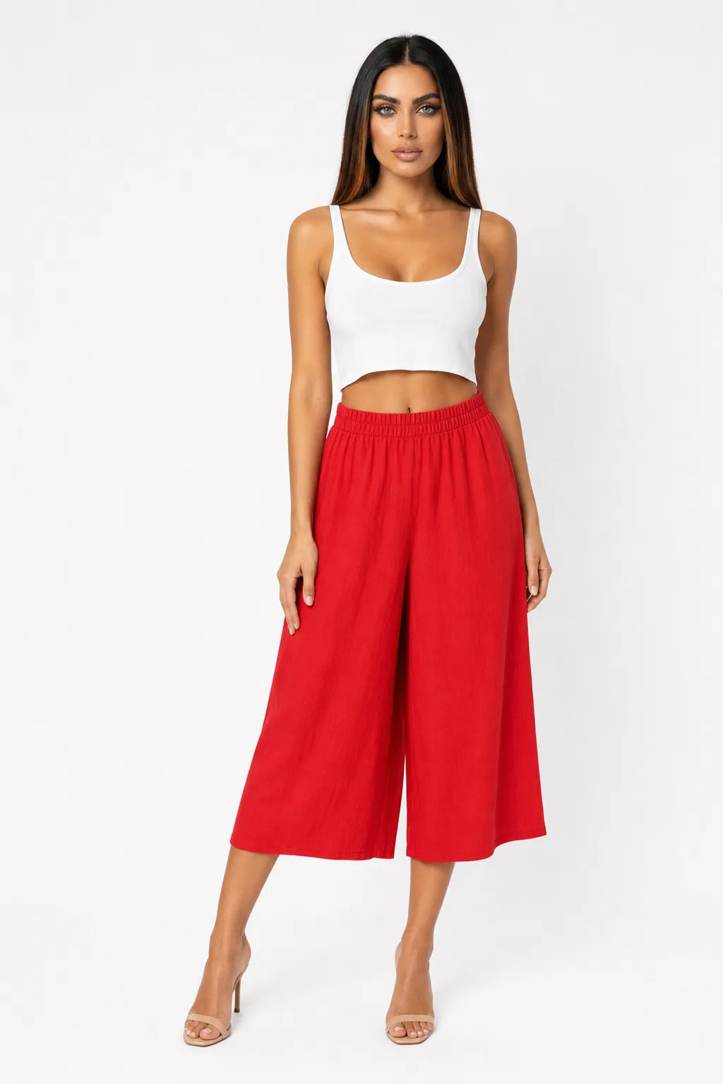 Red cropped wide-leg culottes on a model in a contrapposto stance