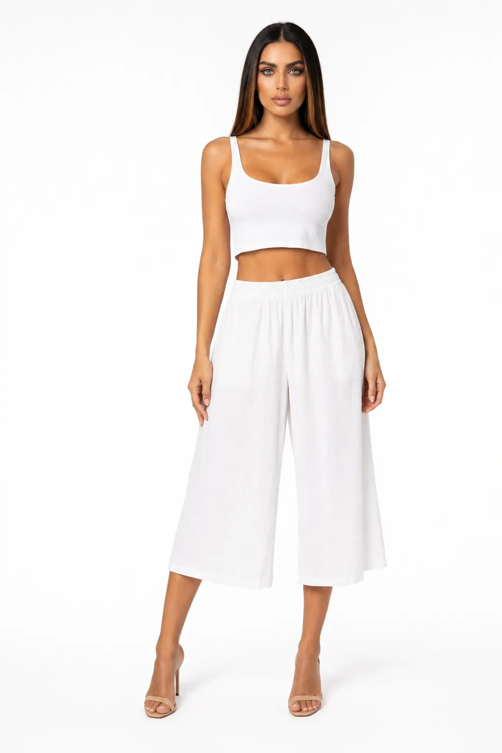 White cropped wide-leg culottes on a model in a contrapposto stance