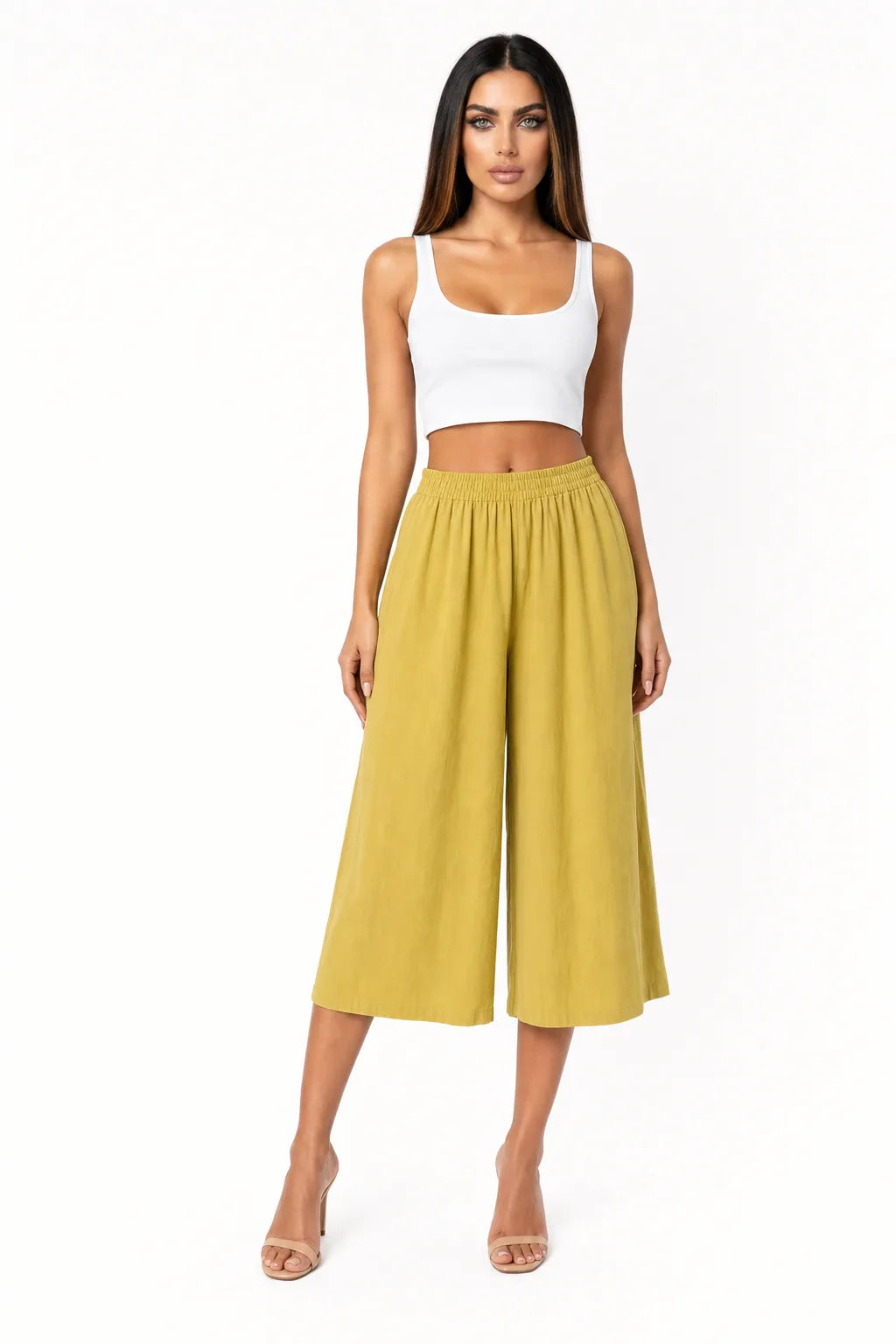 Yellow cropped wide-leg culottes on a model in a contrapposto stance