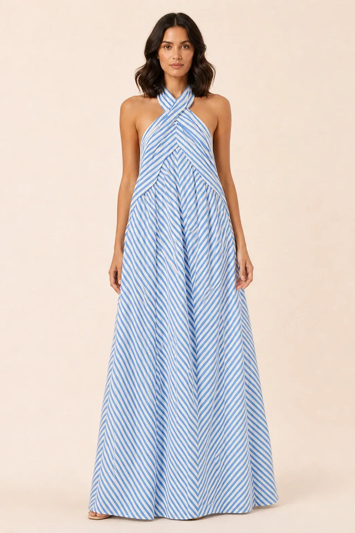 Sky blue crossover halter maxi dress on model in contrapposto stance