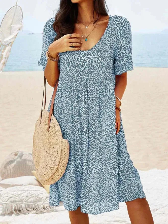 Light blue floral smock dress, model in full-length pose