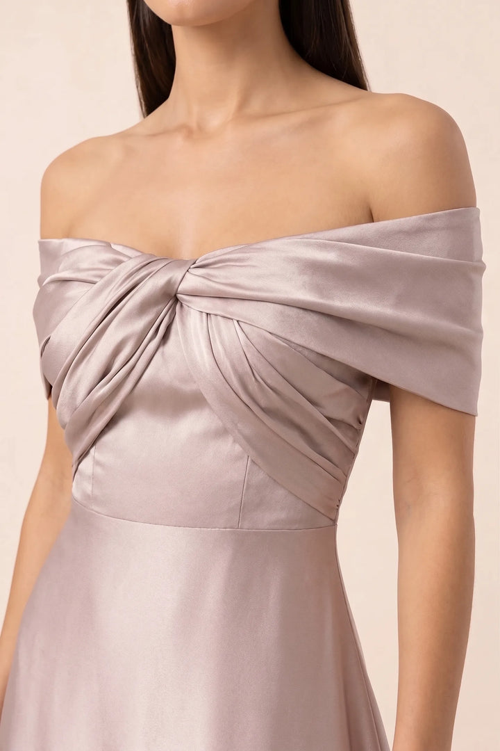 Close-up detail of khaki off-shoulder satin gown bodice and draped neckline
