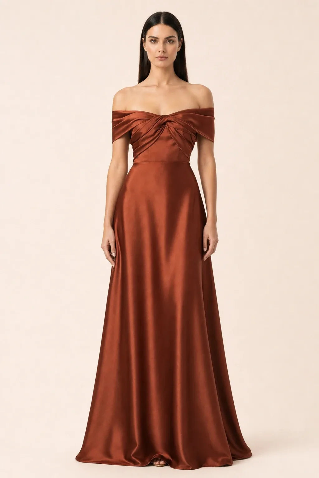 Woman in orange off-shoulder satin gown, weight shifted to one hip in contrapposto stance