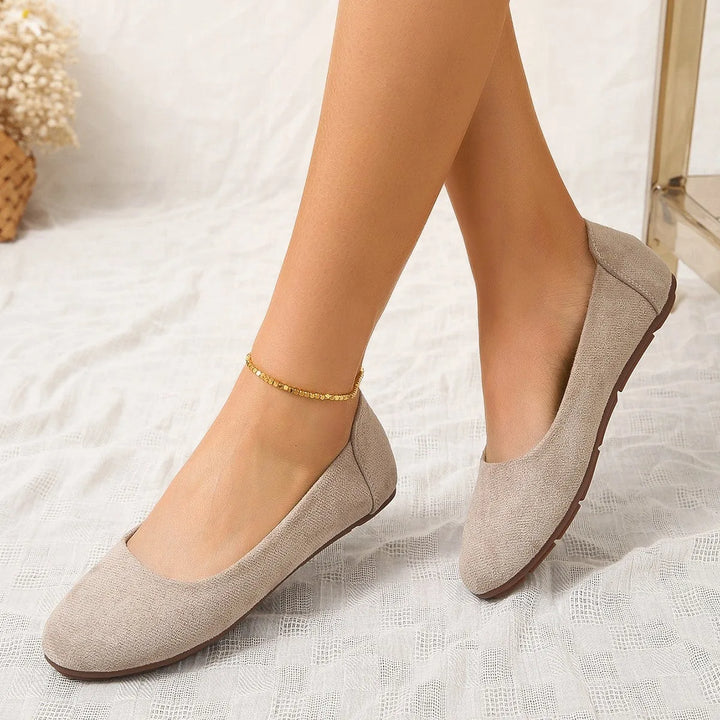 Beige round toe ballet flat, side profile view