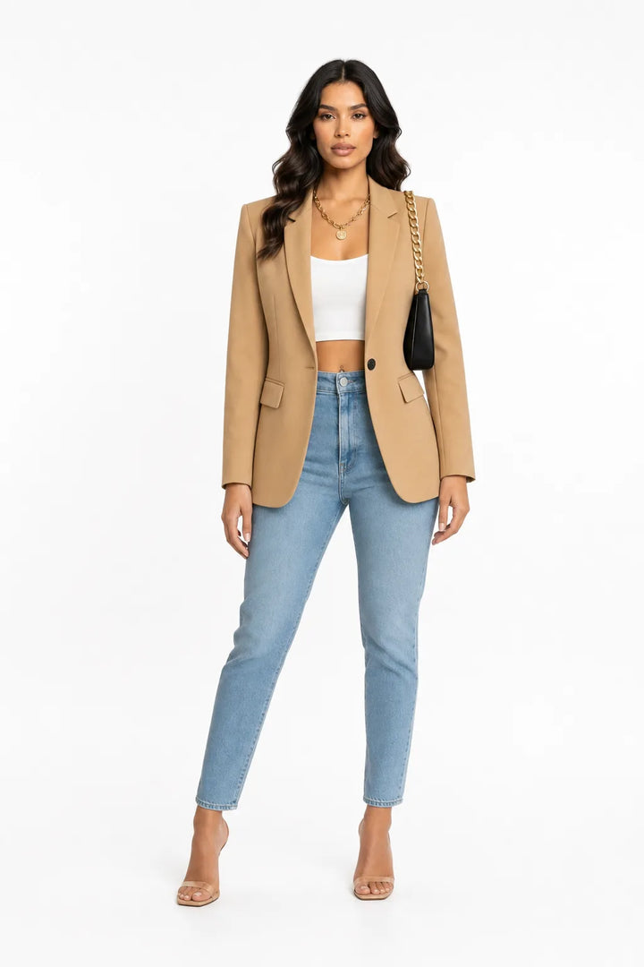 Beige tailored notch lapel blazer on a model in a contrapposto stance