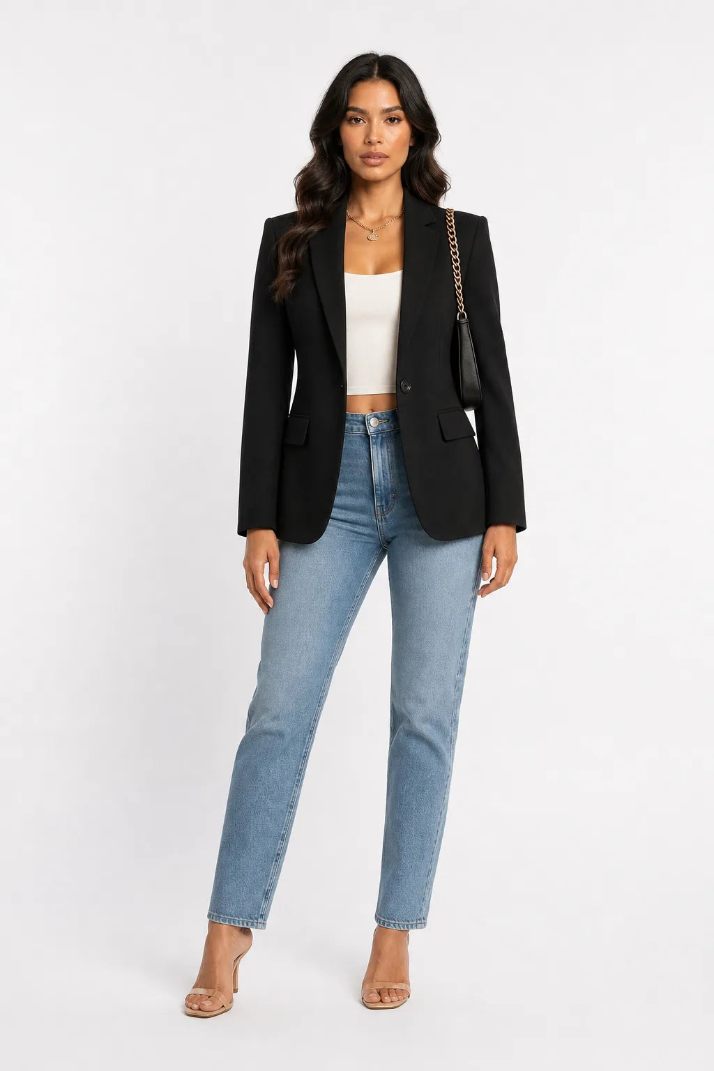 Black tailored notch lapel blazer on a model in a contrapposto stance