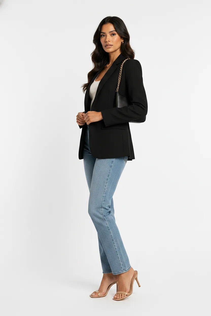 Black tailored notch lapel blazer on a model in a three-quarter turn