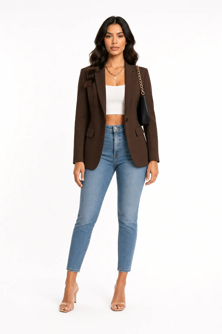 Brown tailored notch lapel blazer on a model in a contrapposto stance