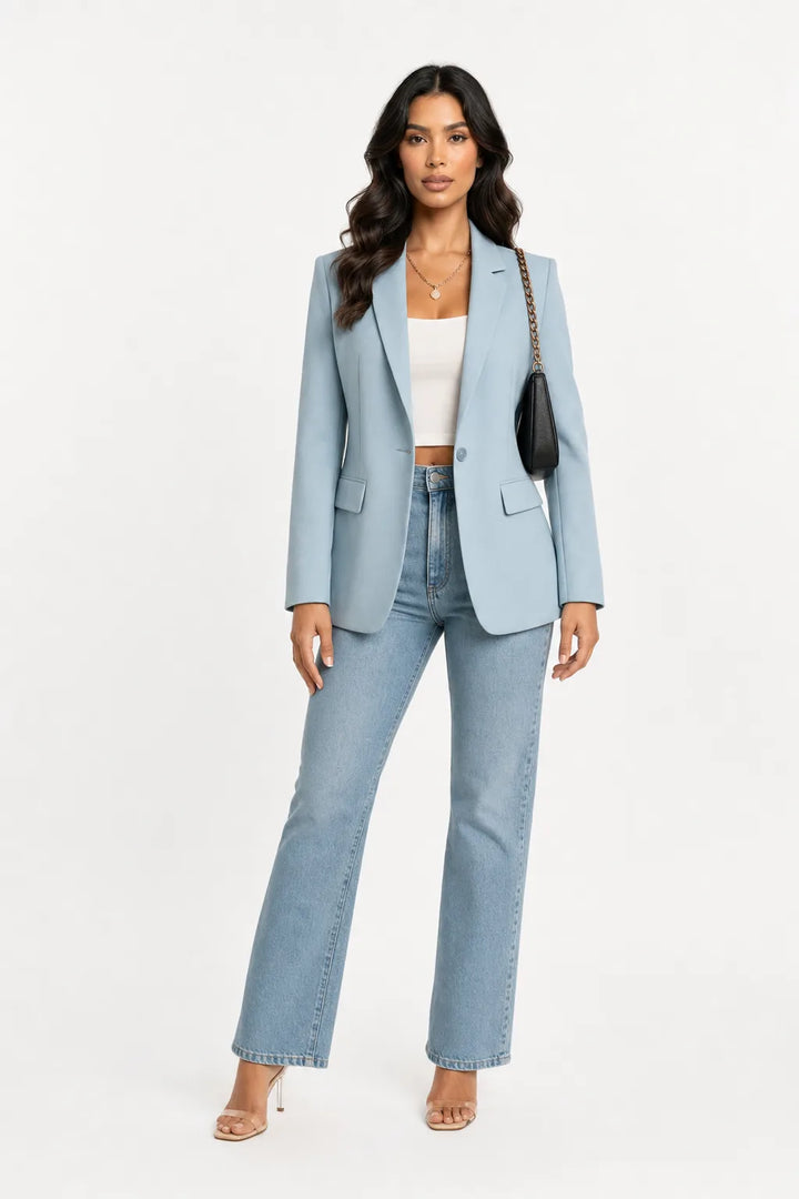 Light blue tailored notch lapel blazer on a model in a contrapposto stance
