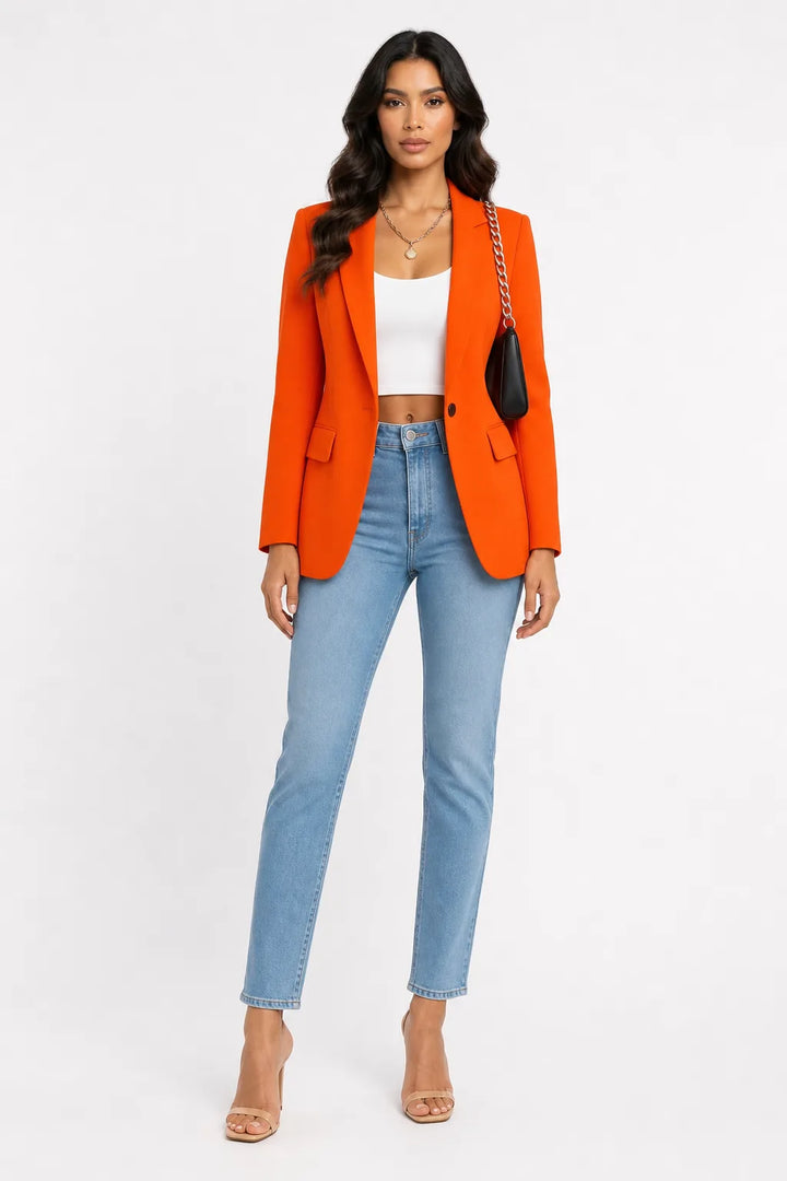 Orange tailored notch lapel blazer on a model in a contrapposto stance