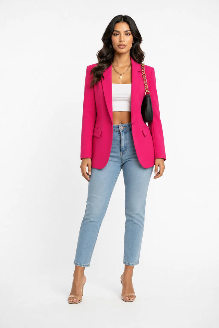 Pink tailored notch lapel blazer on a model in a contrapposto stance