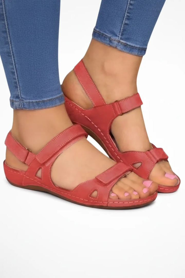 Red low wedge sandal with velcro strap, front view