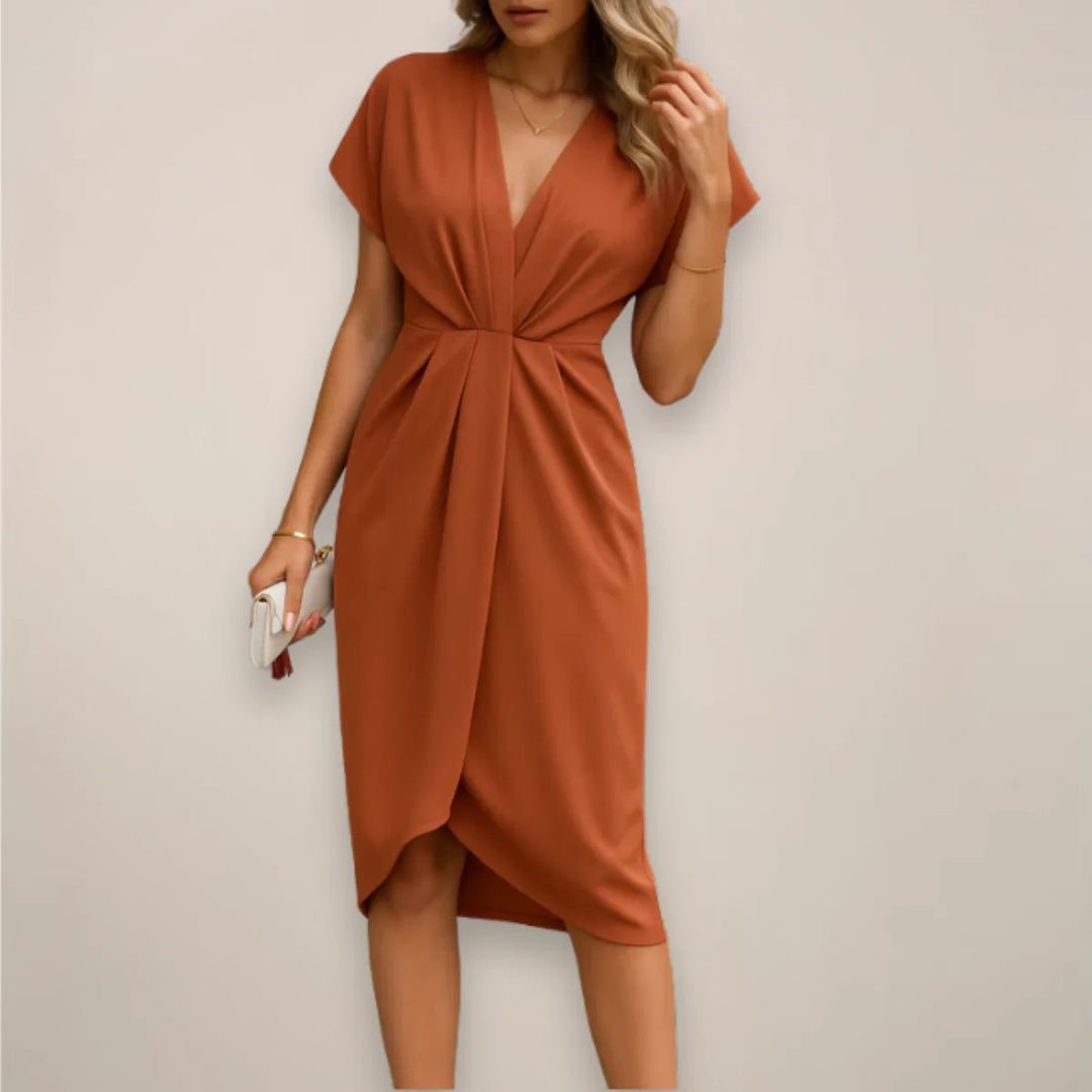 Orange twist front midi dress on model from the side