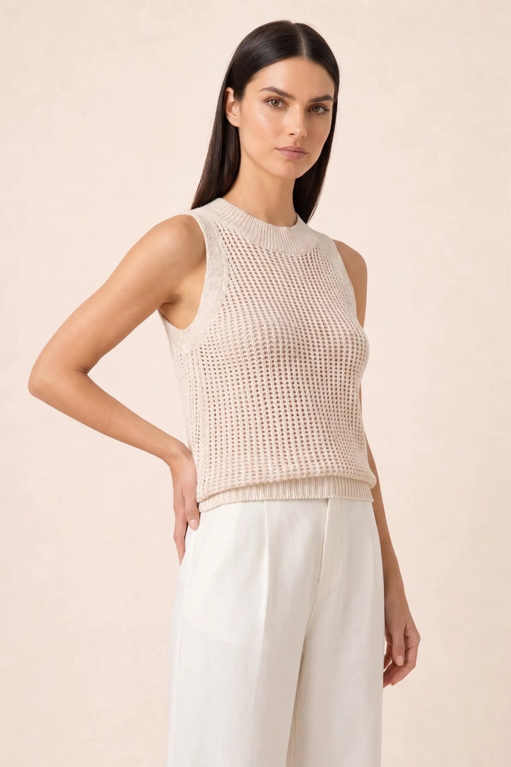 Apricot open knit tank top on model in three-quarter turn