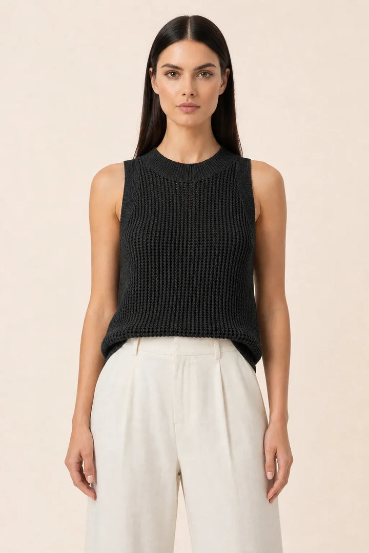Black open knit tank top on model in contrapposto stance