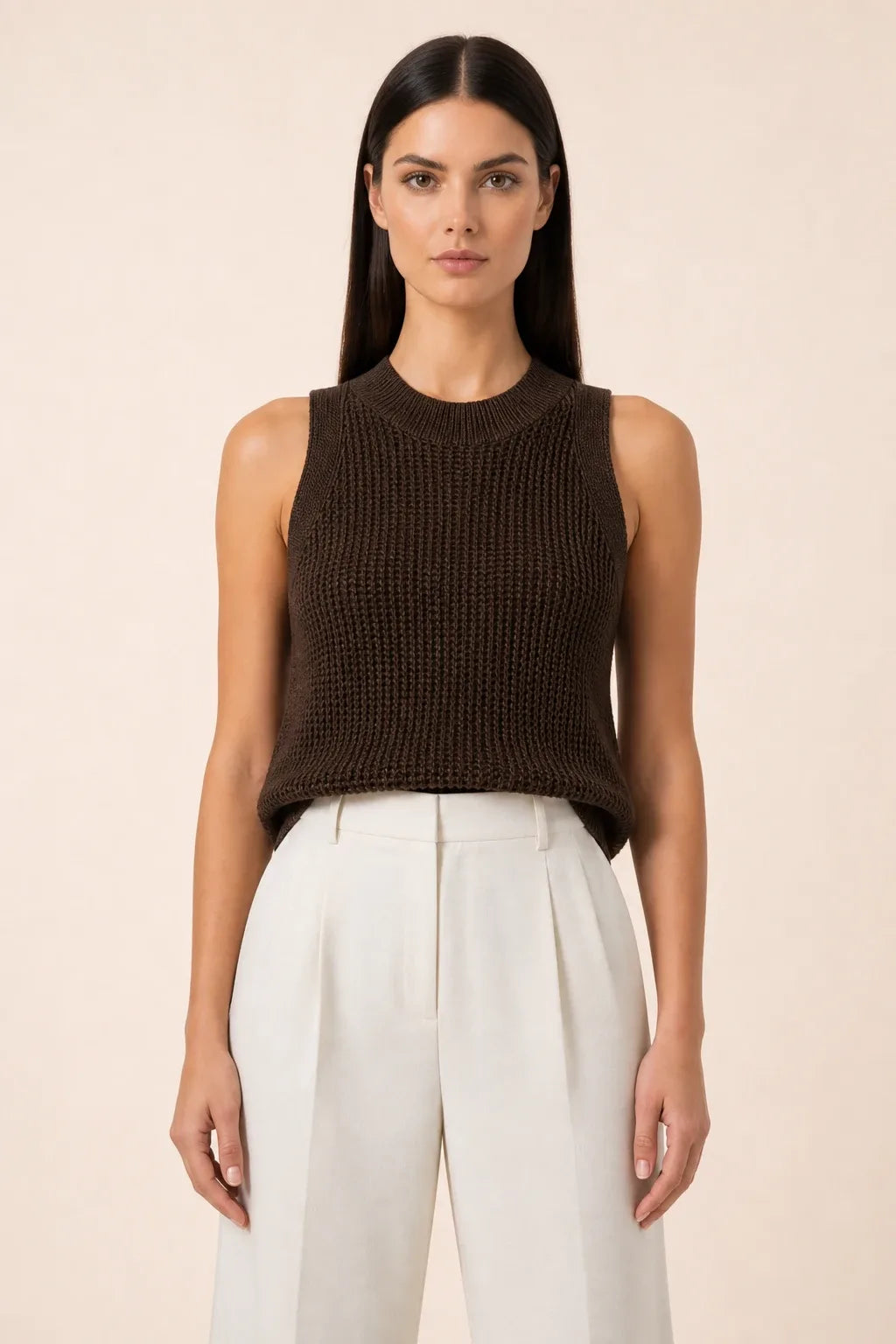 Brown open knit tank top on model in contrapposto stance