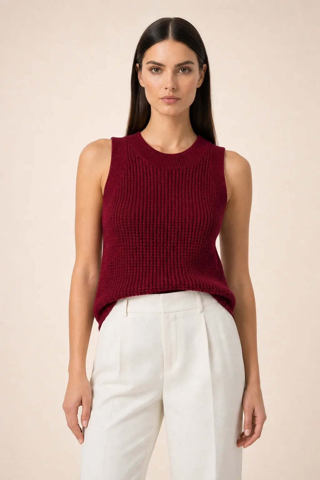 Burgundy open knit tank top on model in contrapposto stance