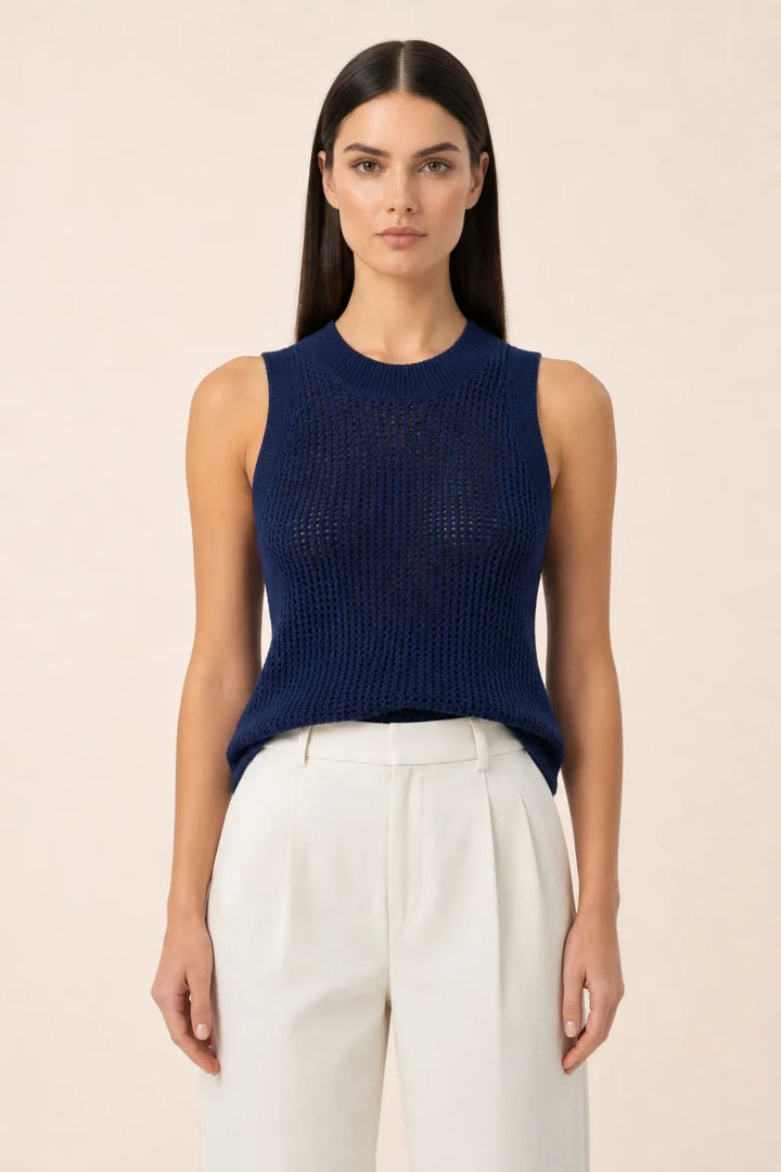 Dark navy open knit tank top on model in contrapposto stance