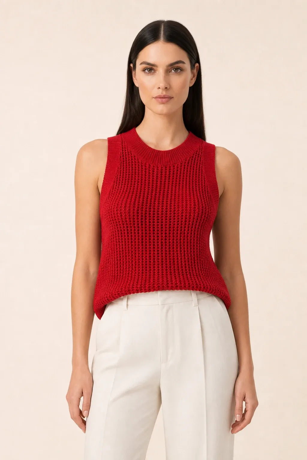 Red open knit tank top on model in contrapposto stance
