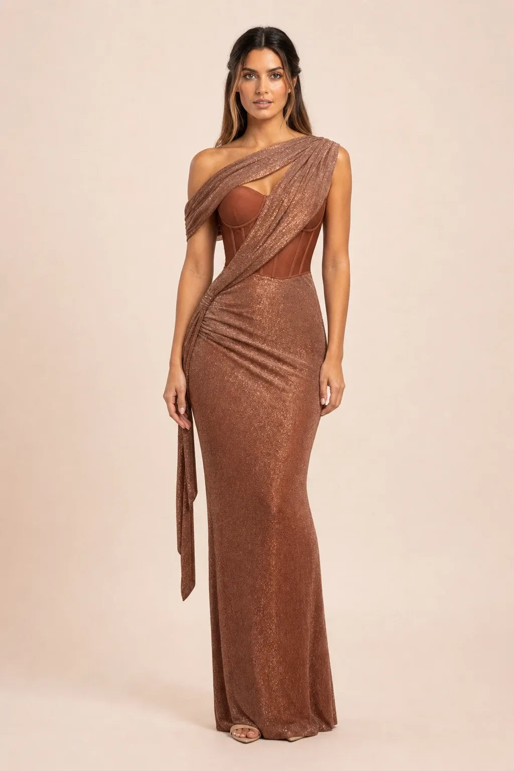 Brown draped corset gown on a model in a contrapposto stance, featuring gathered fabric and structured bodice