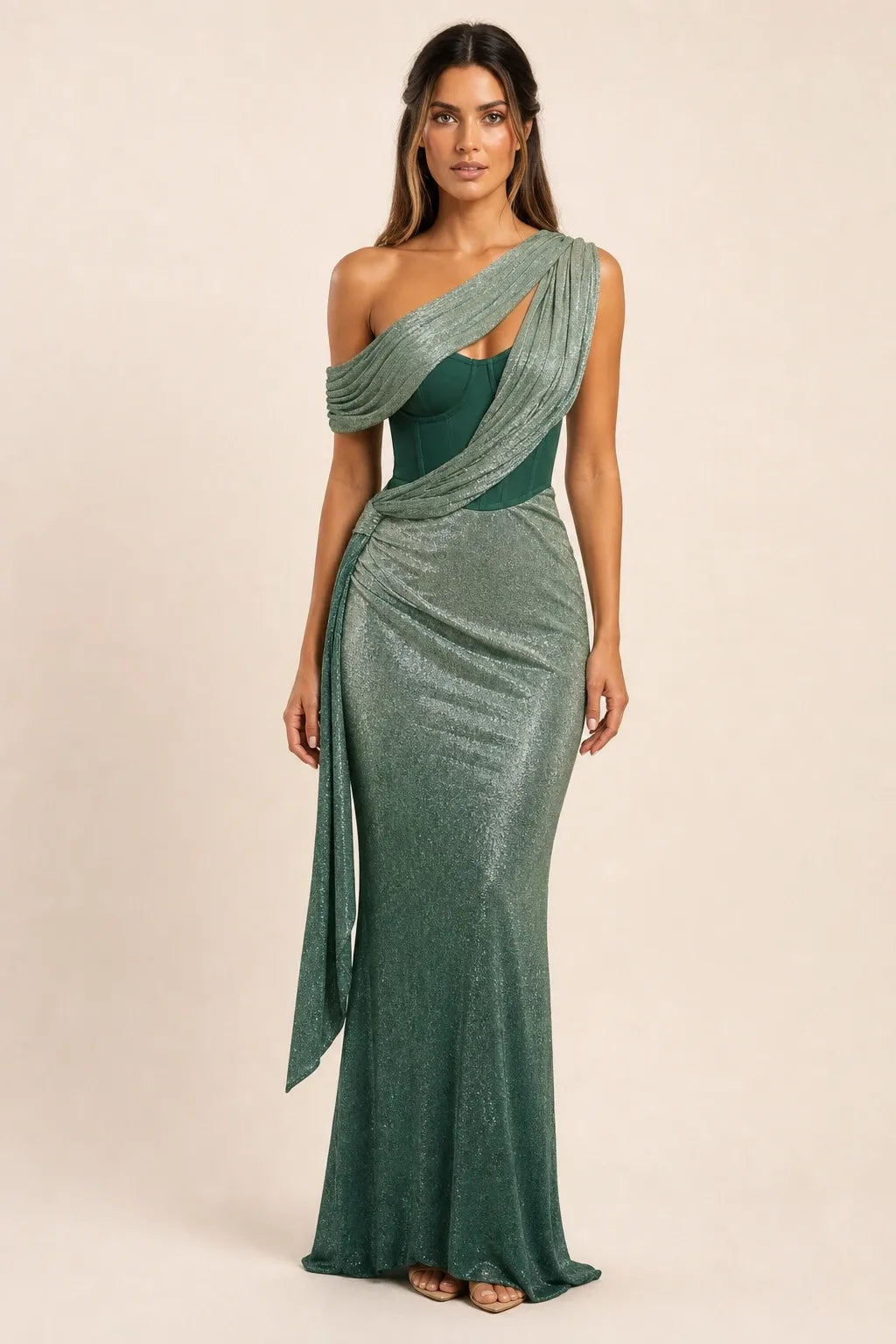 Green draped corset gown on a model in a contrapposto stance, featuring gathered fabric and structured bodice