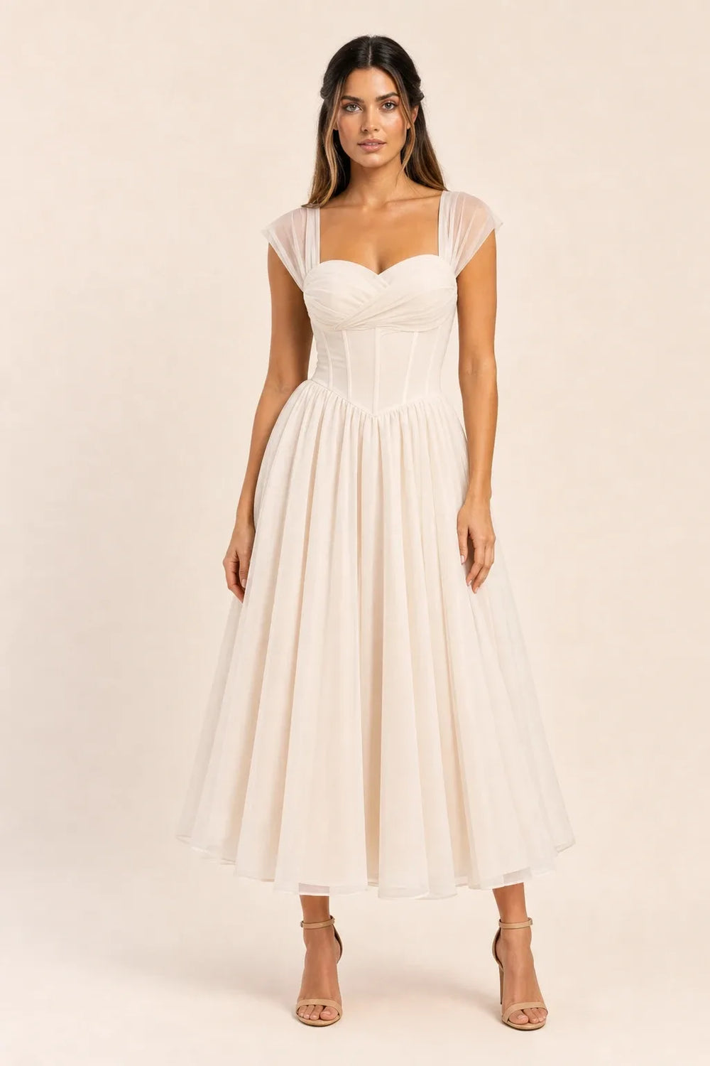 Apricot corset tulle midi dress on model in contrapposto stance