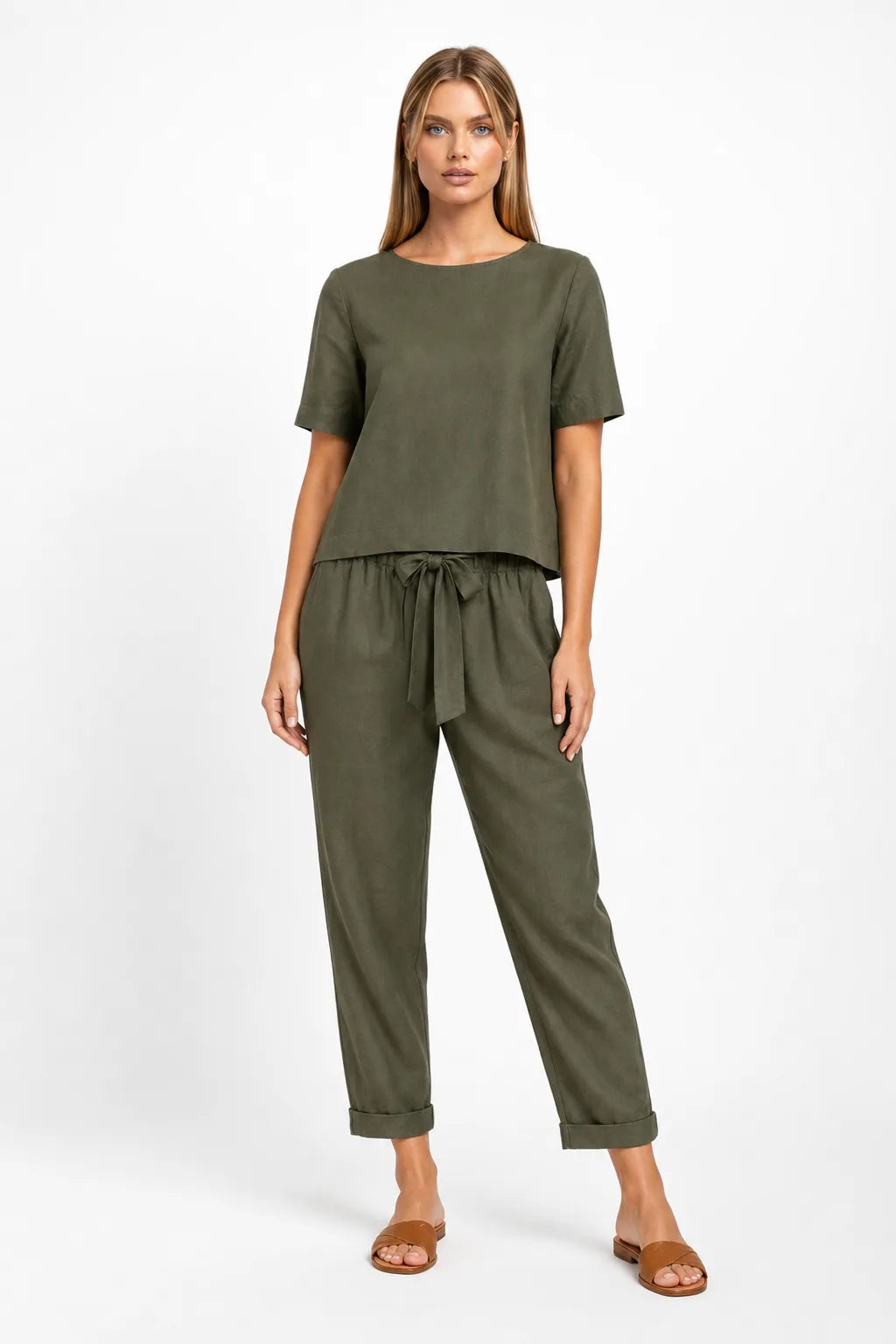 Army green linen crop top on model in relaxed contrapposto stance
