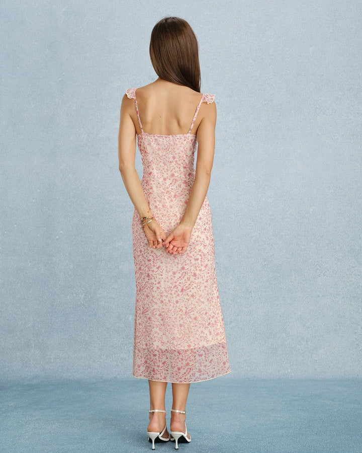 Model standing in a pink ruffle-strap midi dress showing silhouette and fit