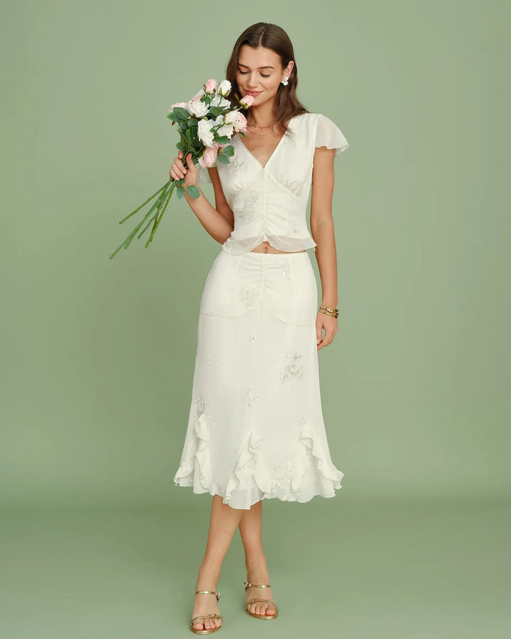 Apricot ruched embroidered midi skirt on model, alternate view