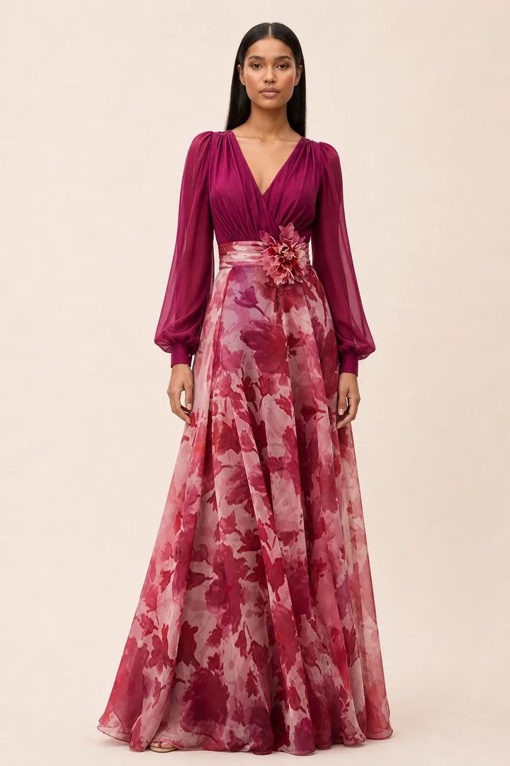 Bubblegum pink floral maxi dress with balloon sleeves on a model in a contrapposto stance