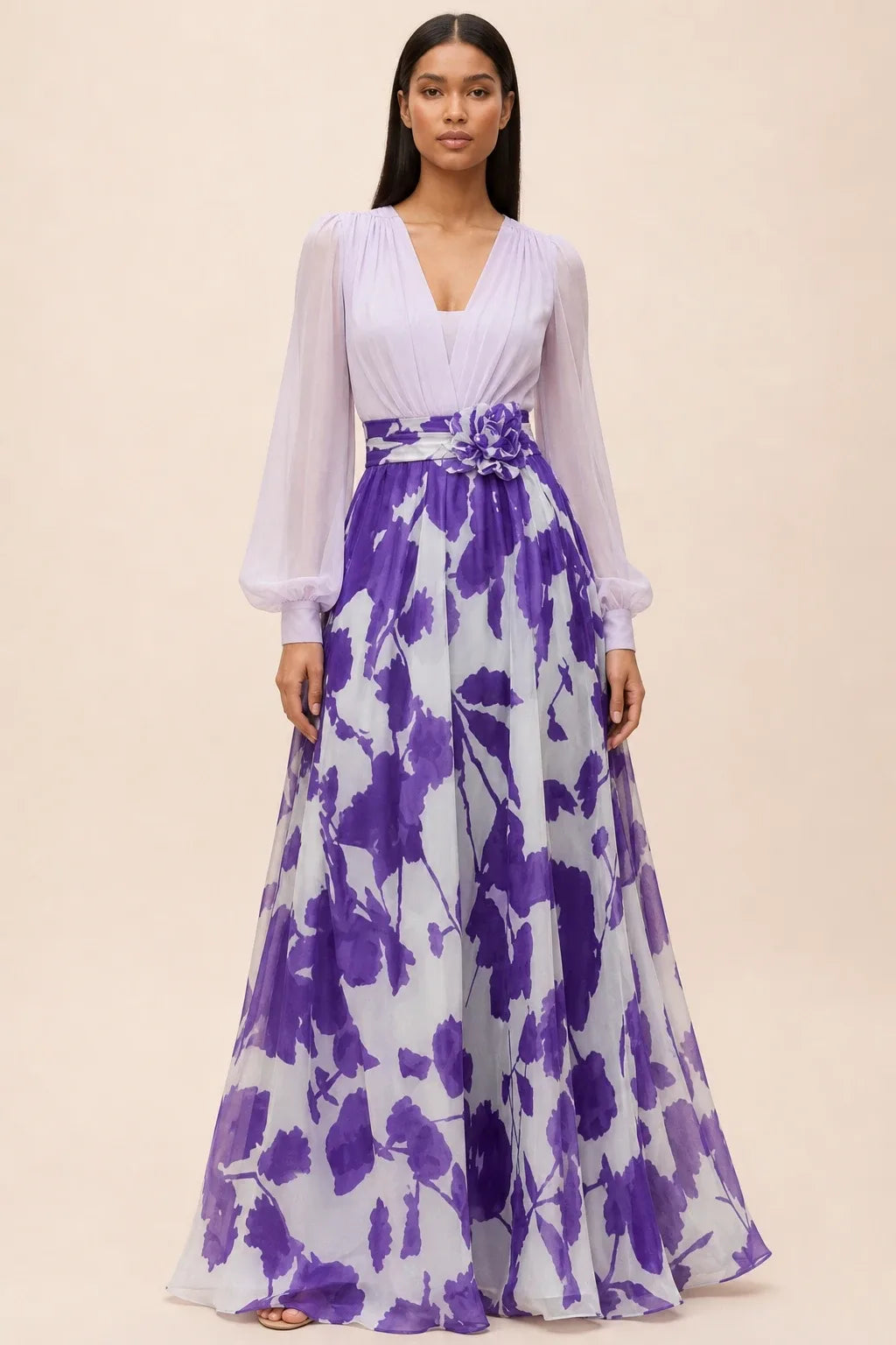 Lilac and turquoise floral maxi dress with balloon sleeves on a model in a contrapposto stance