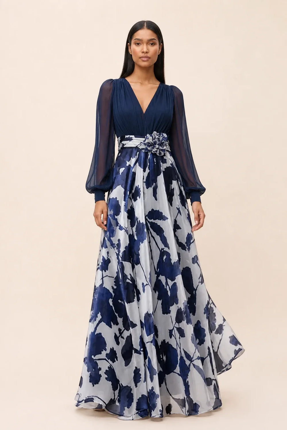 Navy blue floral maxi dress with balloon sleeves on a model in a contrapposto stance