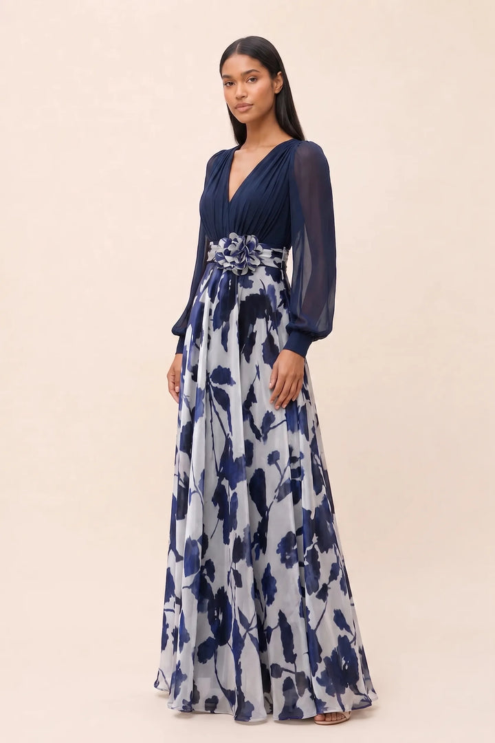 Navy blue floral maxi dress with balloon sleeves on a model in a three-quarter turn