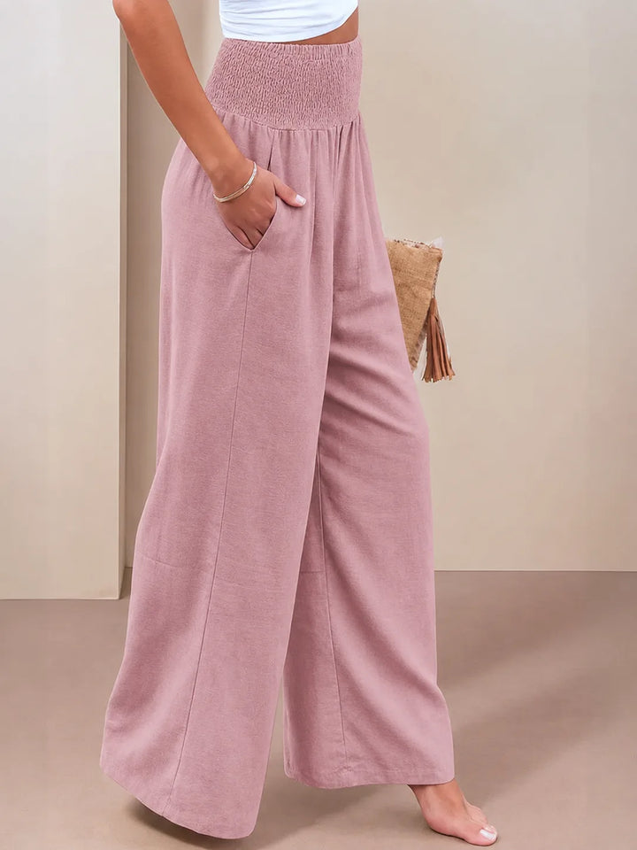 Khaki smocked wide leg pants on model, casual full-length view