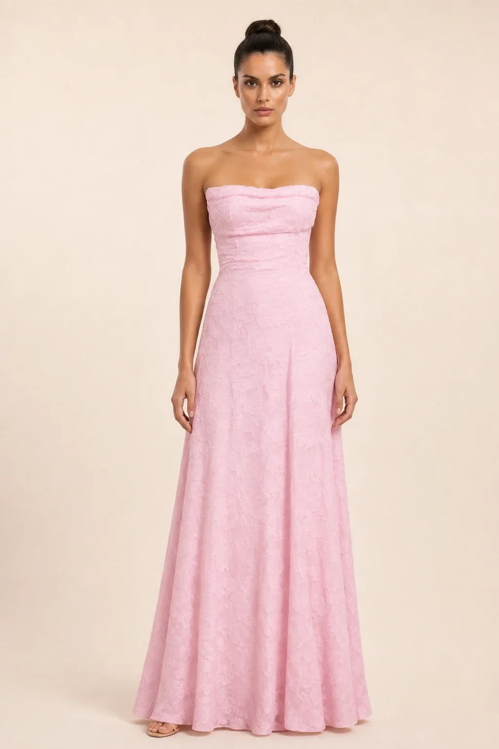Pink jacquard ruched maxi dress on model in contrapposto stance