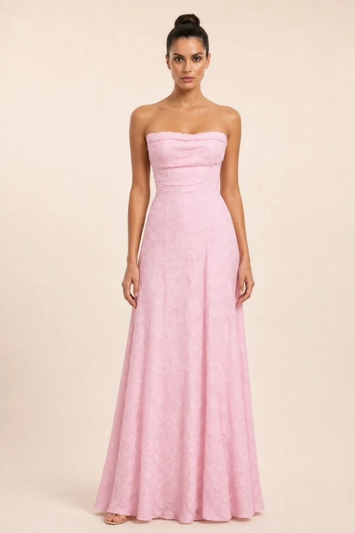 Pink jacquard ruched maxi dress on model in contrapposto stance