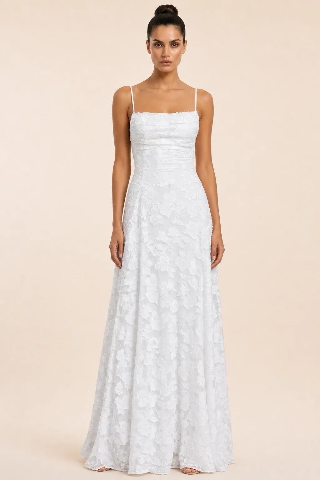 White jacquard ruched maxi dress on model in contrapposto stance